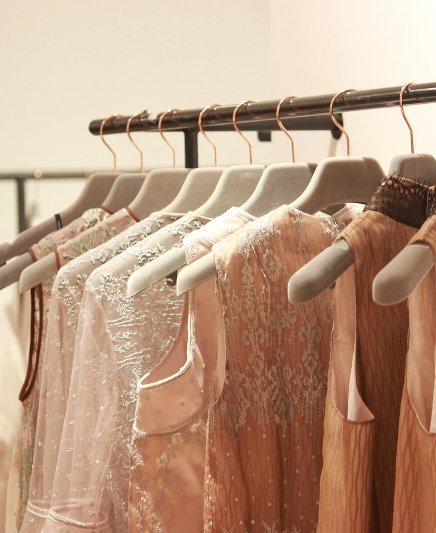 Boutique clothing rack with curated outfits